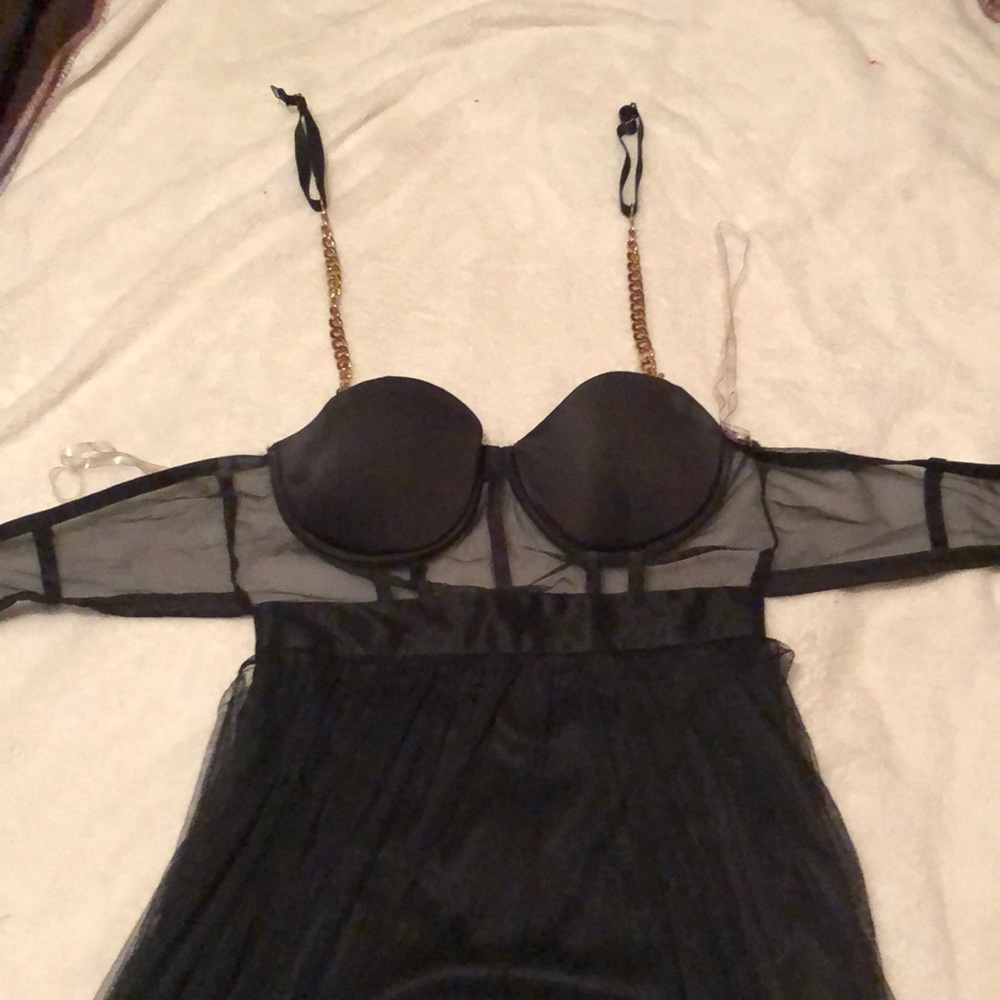 Black w/ gold chain prom gown. Duel split in front with mesh covering.
